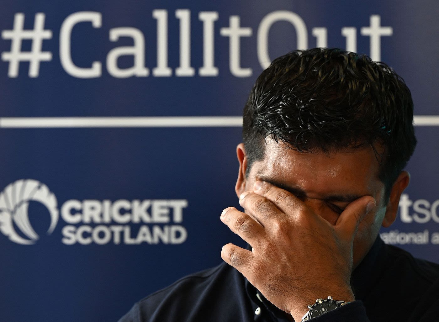 Majid Haq reacts during the press conference