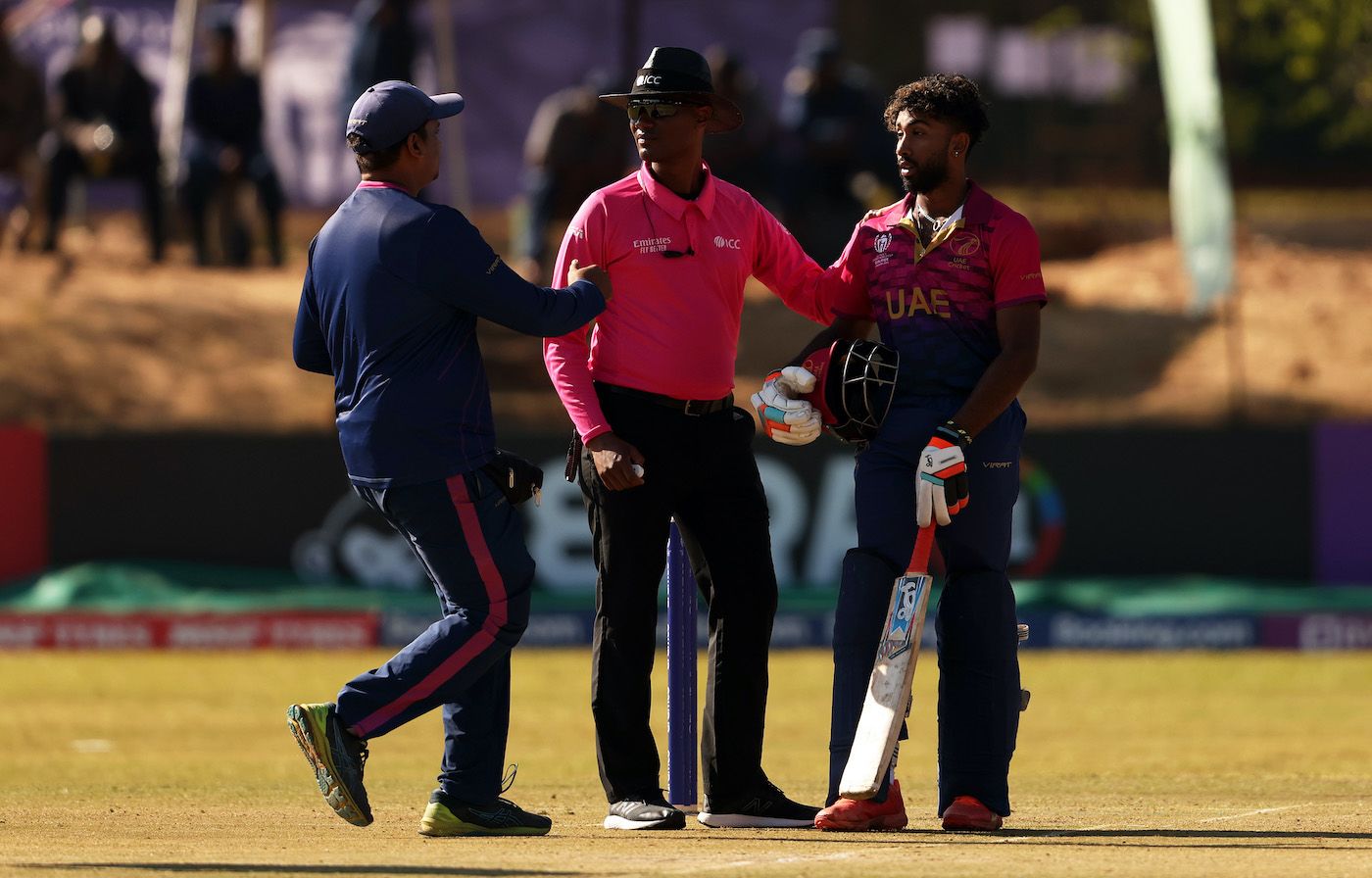 The physio tends to Vriitya Aravind who was hit on the head