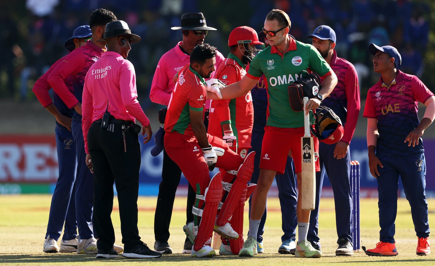 The physio tends to Shoaib Khan who retired hurt with cramps