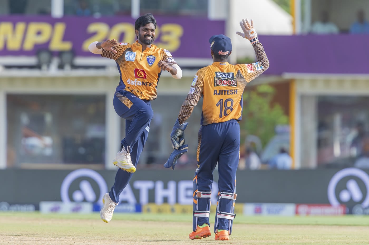 M Poiyamozhi and G Ajitesh celebrate a wicket