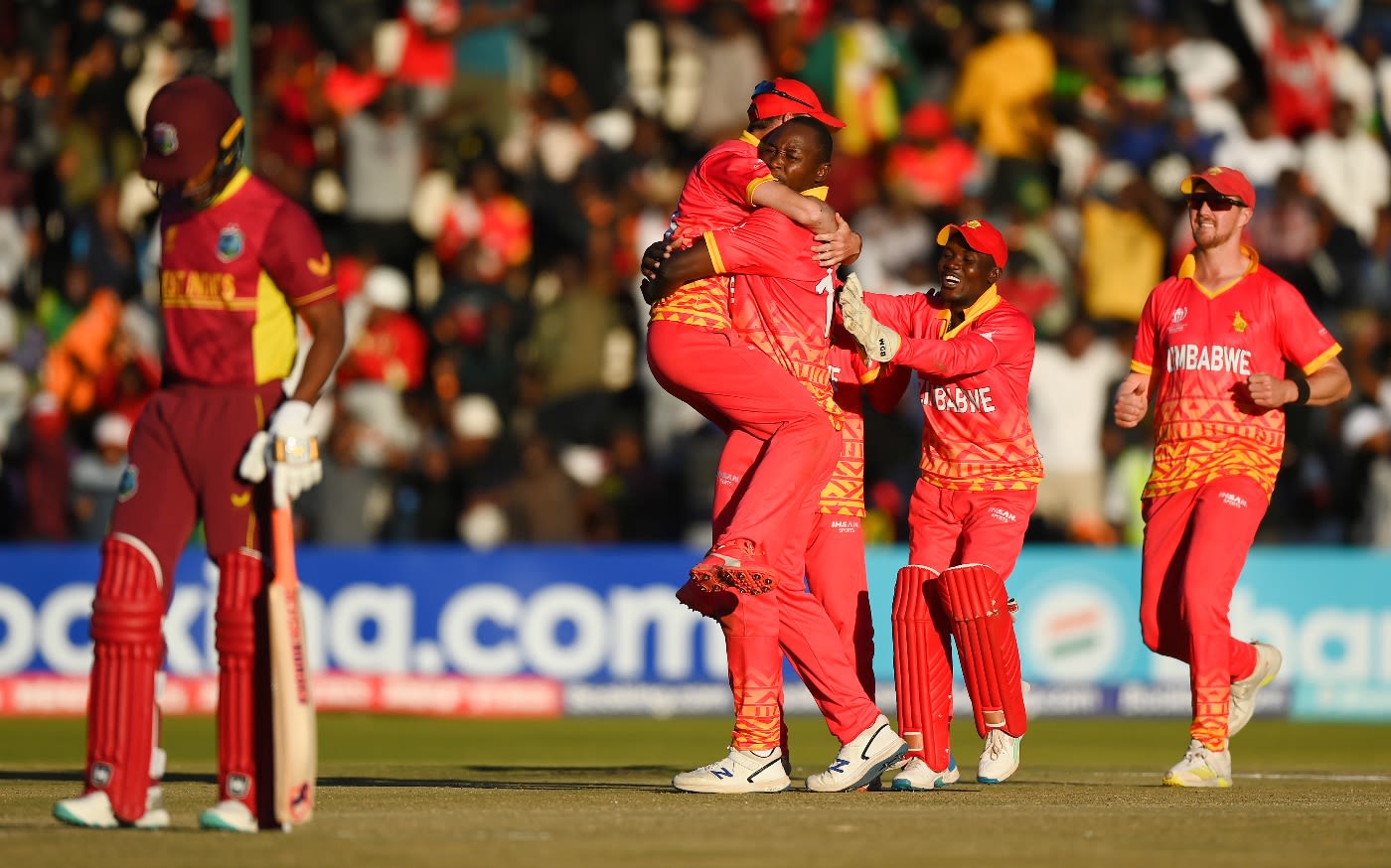 The Zimbabwe players celebrate as Tendai Chatara dismisses Roston Chase