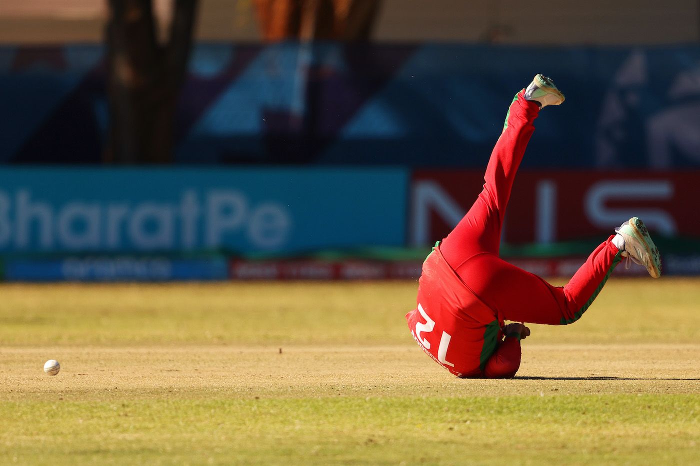 Zeeshan Maqsood tumbles in an attempt to stop the ball