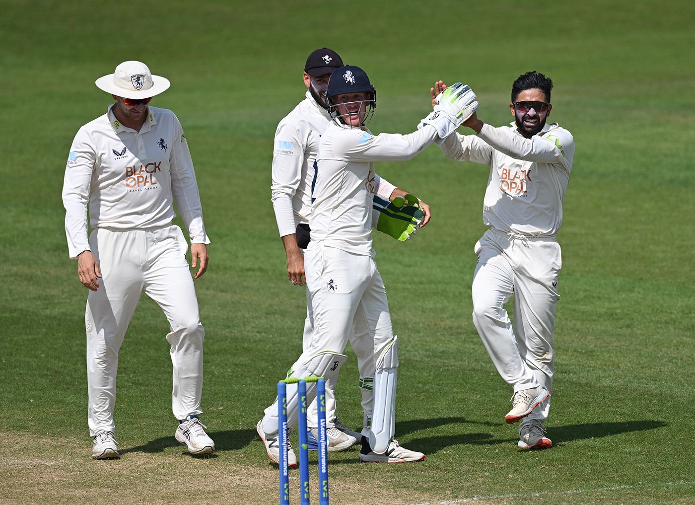 Hamidullah Qadri is congratulated by his team-mates