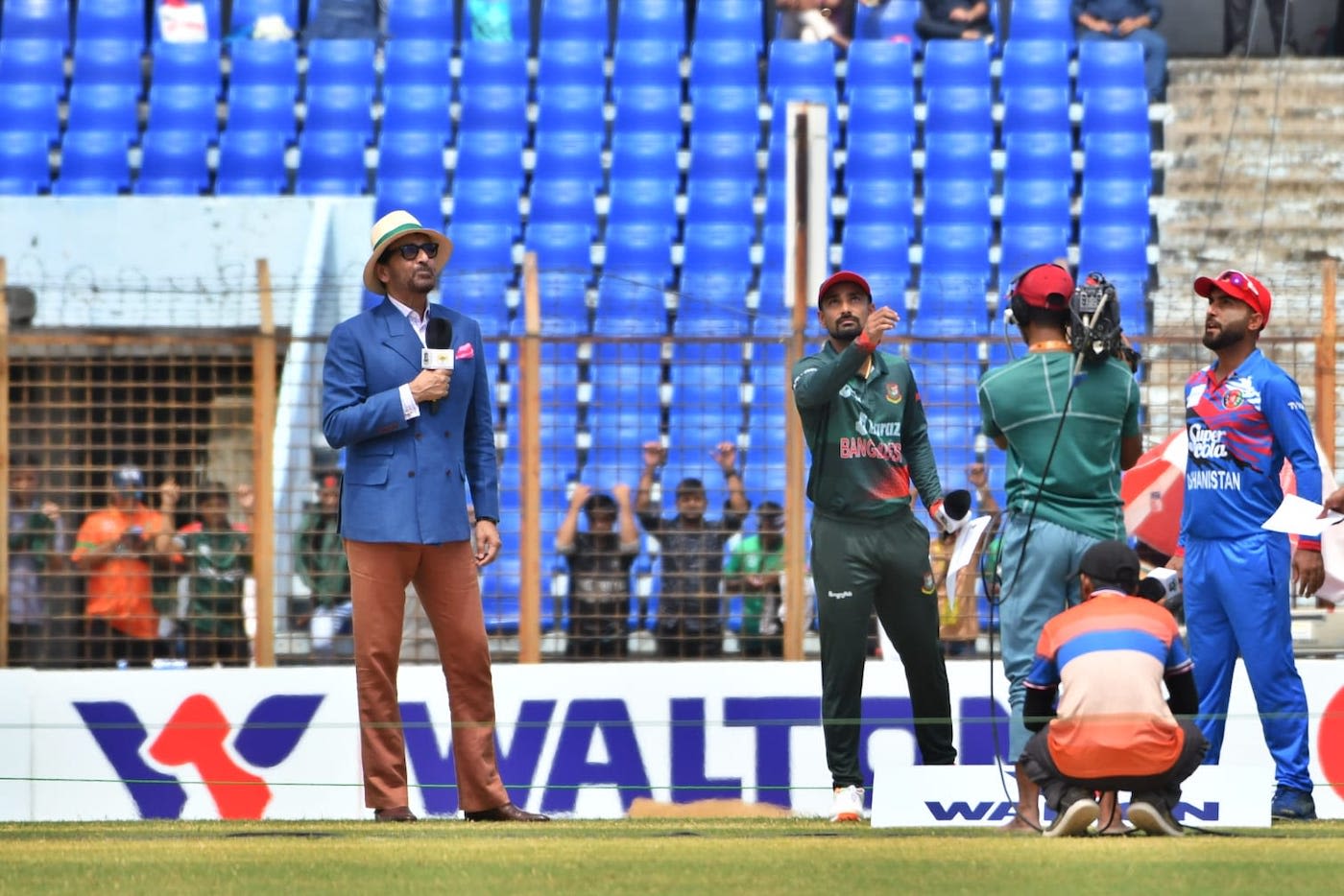 Litton Das and Hashmatullah Shahidi along with Athar Ali Khan at the toss