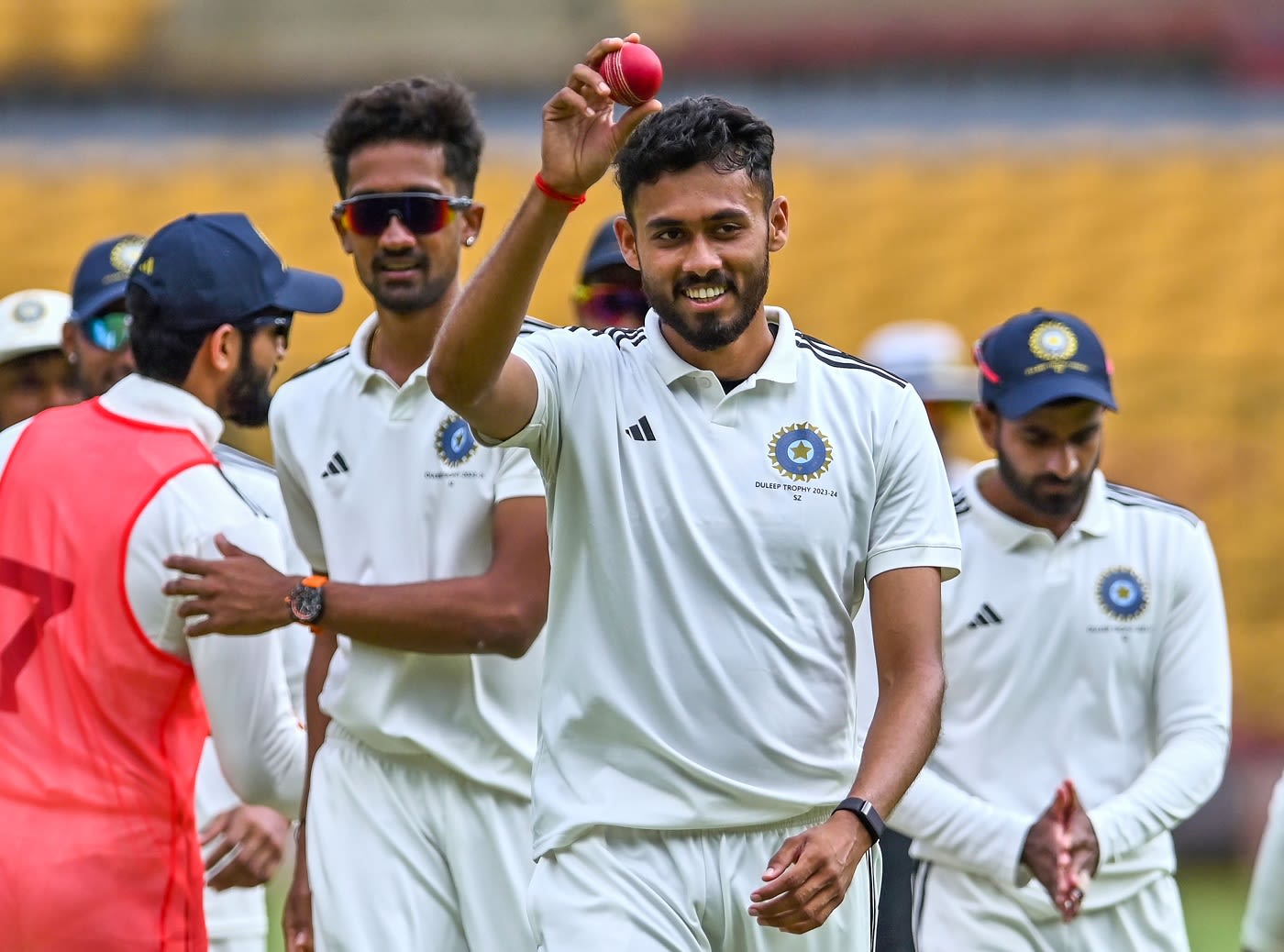 Vidwath Kaverappa holds the ball aloft after picking career-best figures of 7 for 53
