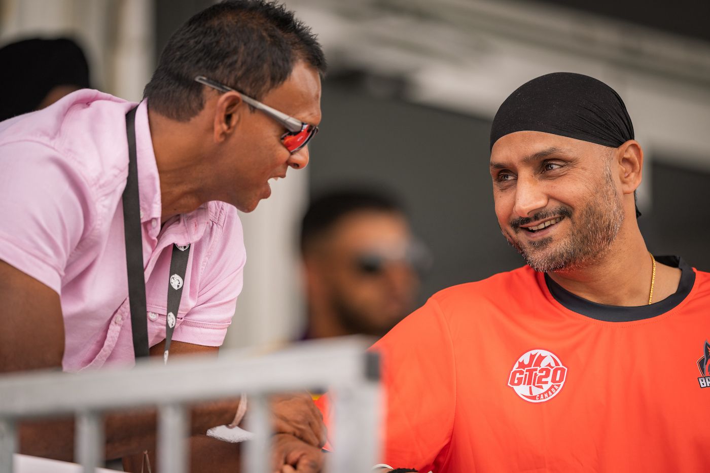 Shivnarine Chanderpaul and Harbhajan Singh catch up on the sidelines of the game