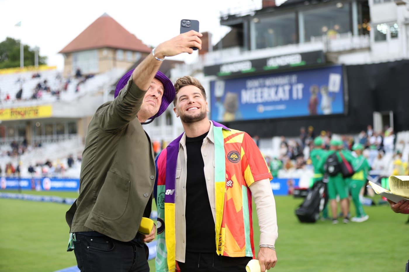 Michael Vaughan takes a selfie with BBC presenter Chris Hughes