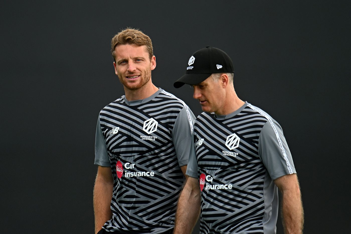 Jos Buttler and Simon Katich wait for the rain to clear