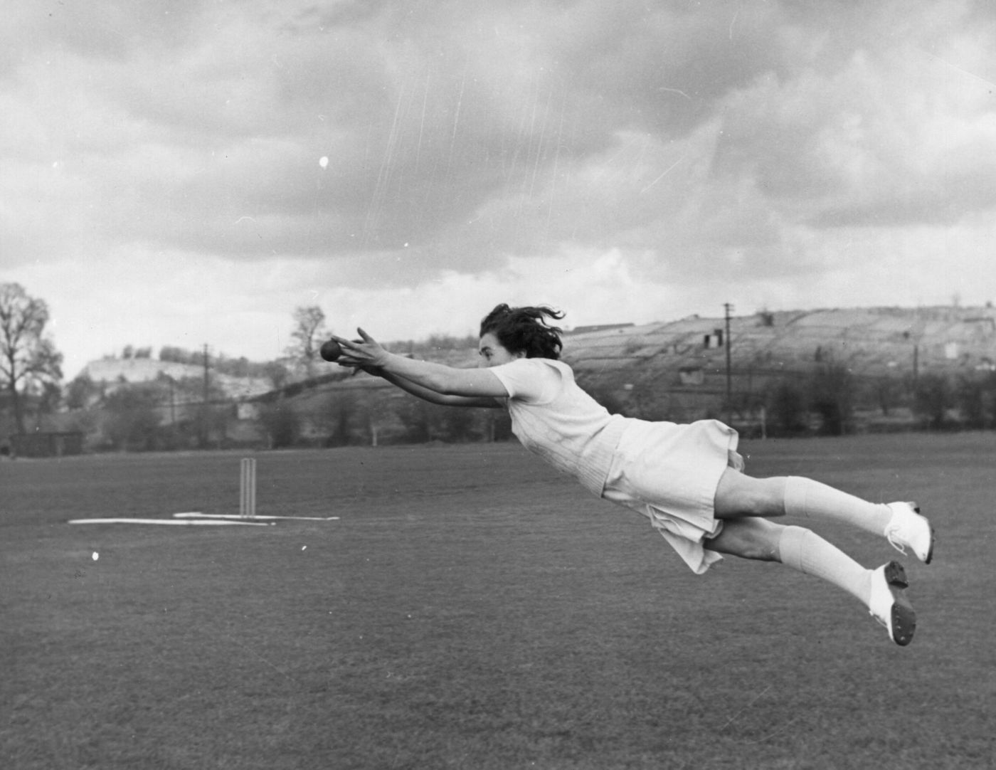 Yorkshire and England women's fast bowler Mary Johnson leaps at full stretch for a catch