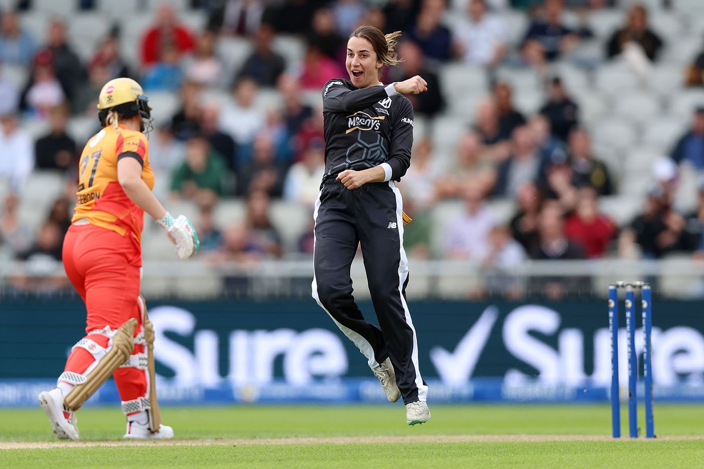 Fi Morris celebrates after taking the wicket of Amy Jones