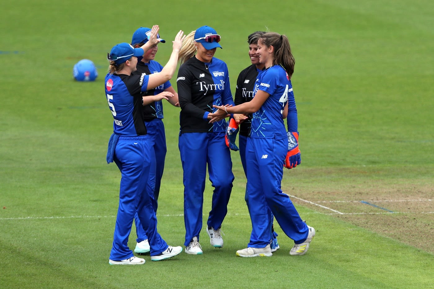 Sophie Munro celebrates with her team-mates