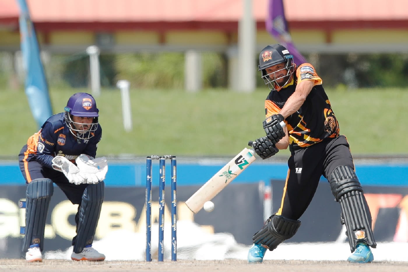 Parthiv Patel looks on with Shahid Afridi going for a big shot in his 11-ball 22