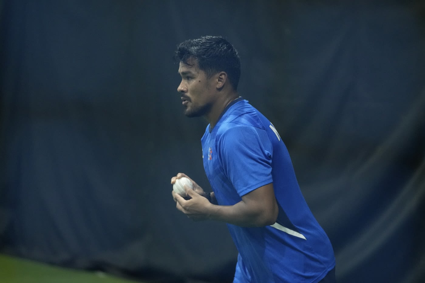 Karan KC gets ready to bowl