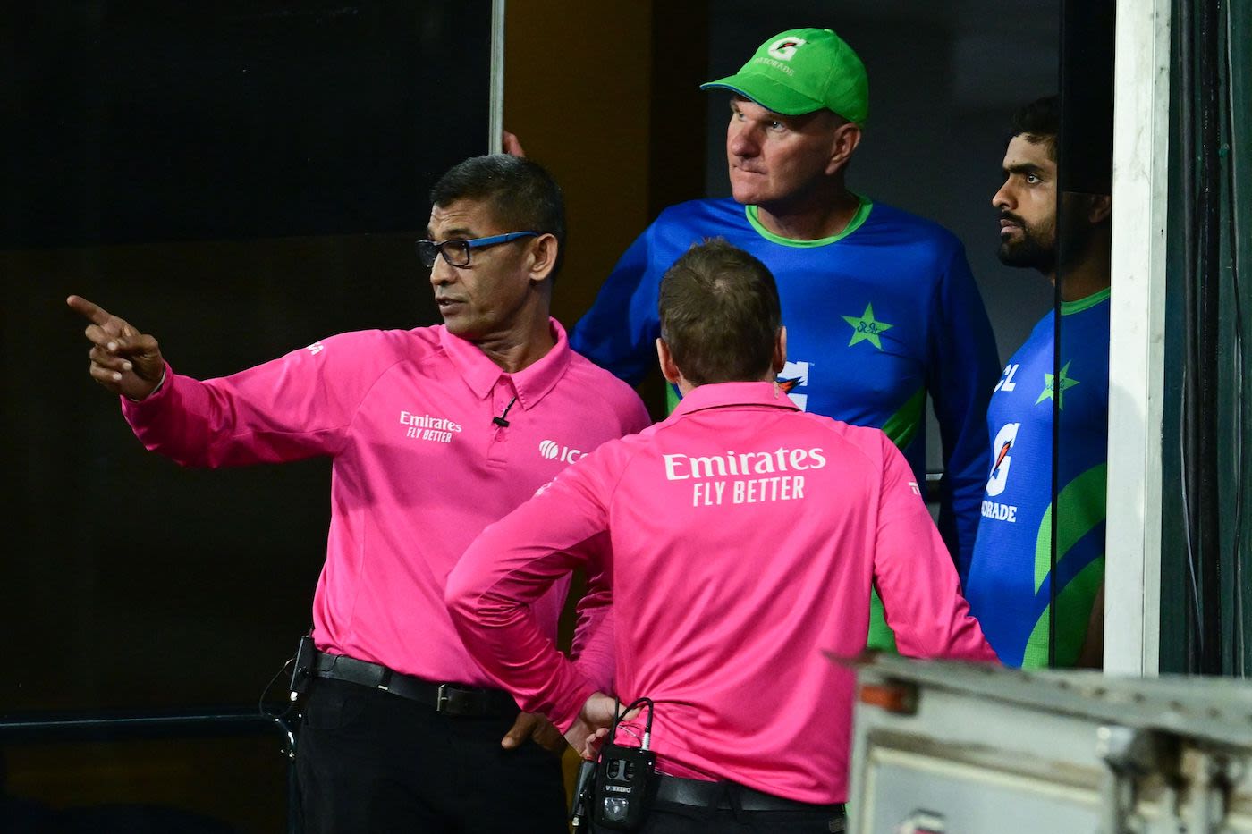 Ruchira Palliyaguruge appears to be pointing out the problem areas on the ground to the Pakistan camp
