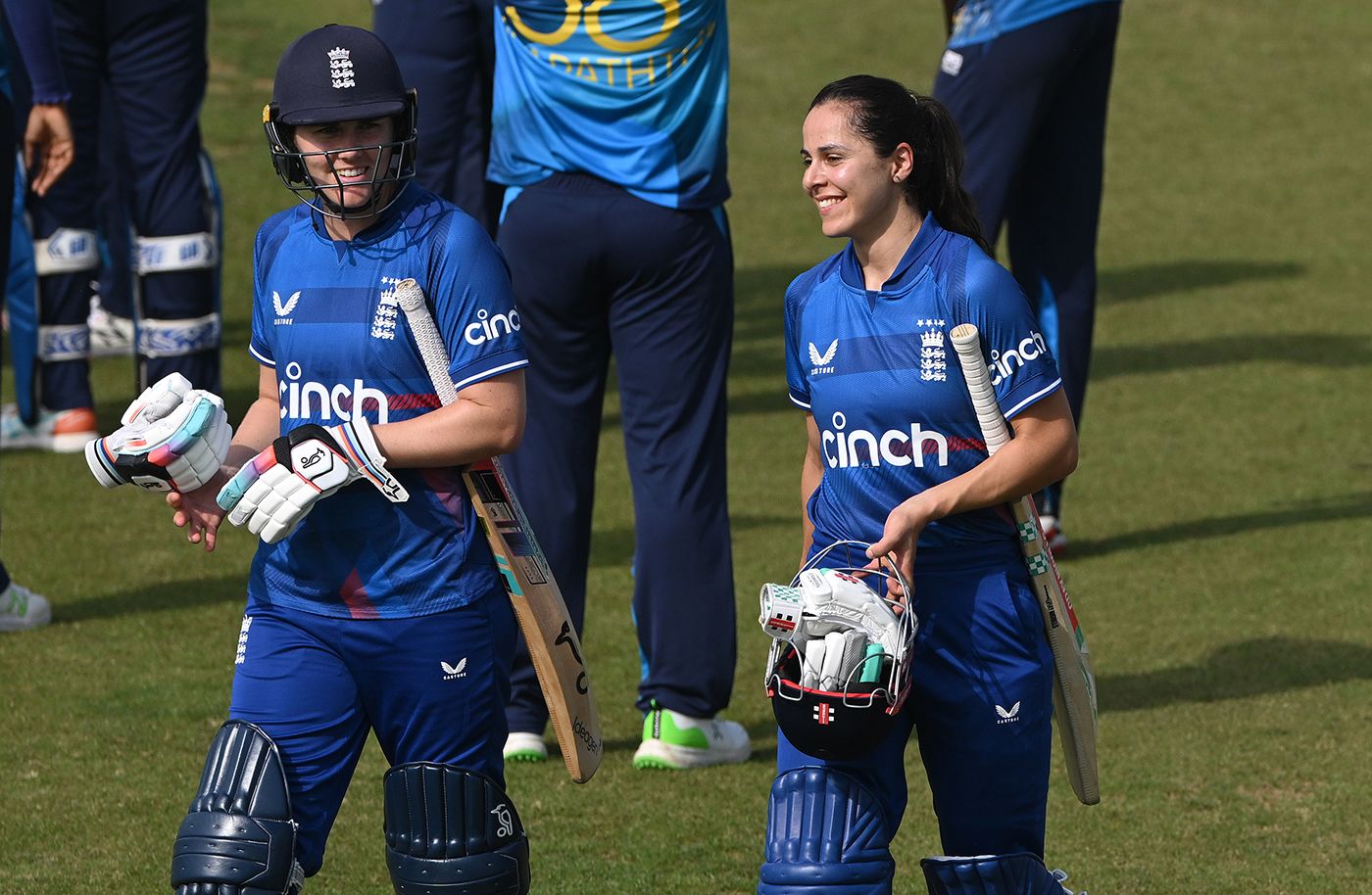 Nat Sciver-Brunt and Maia Bouchier walk off after completing victory