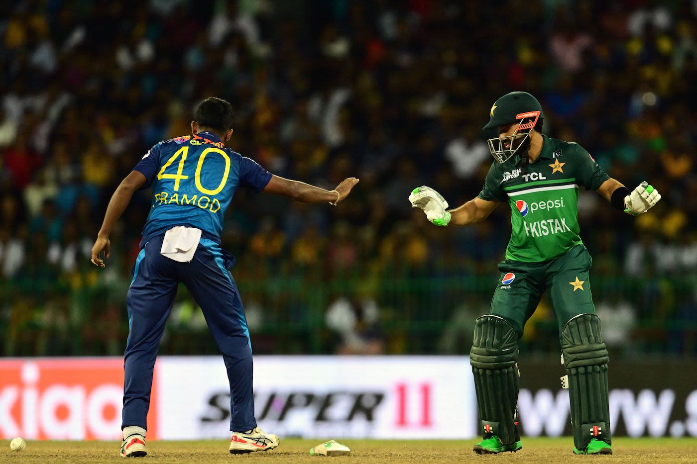 Pramod Madushan and Mohammad Rizwan got in an awkward position