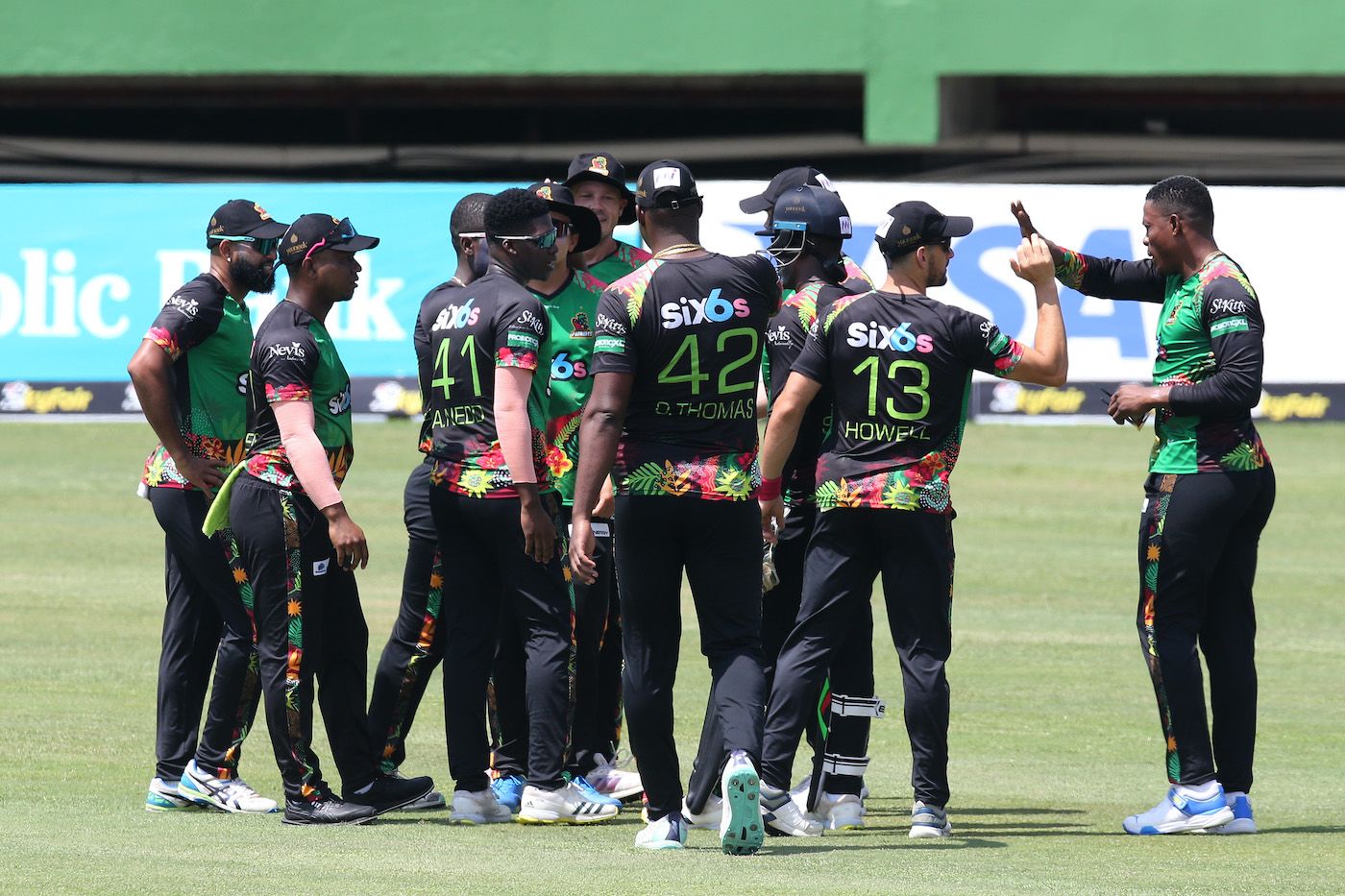 Ashmead Nedd, who took a two-for, celebrates with his team-mates