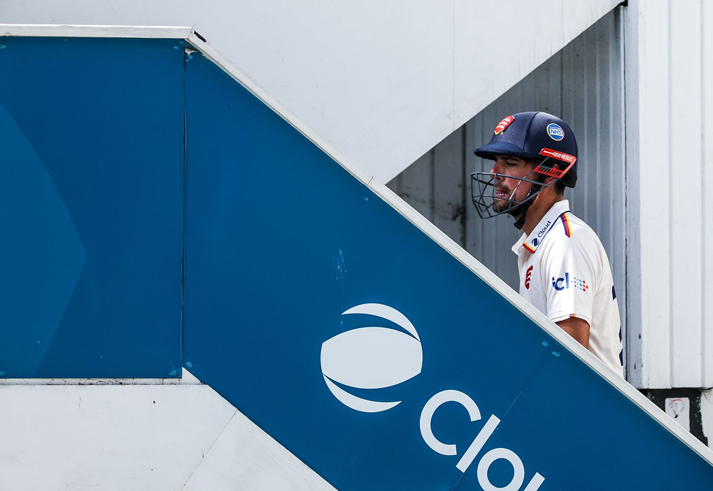 Alastair Cook walks up the steps to the dressing room after being dismissed
