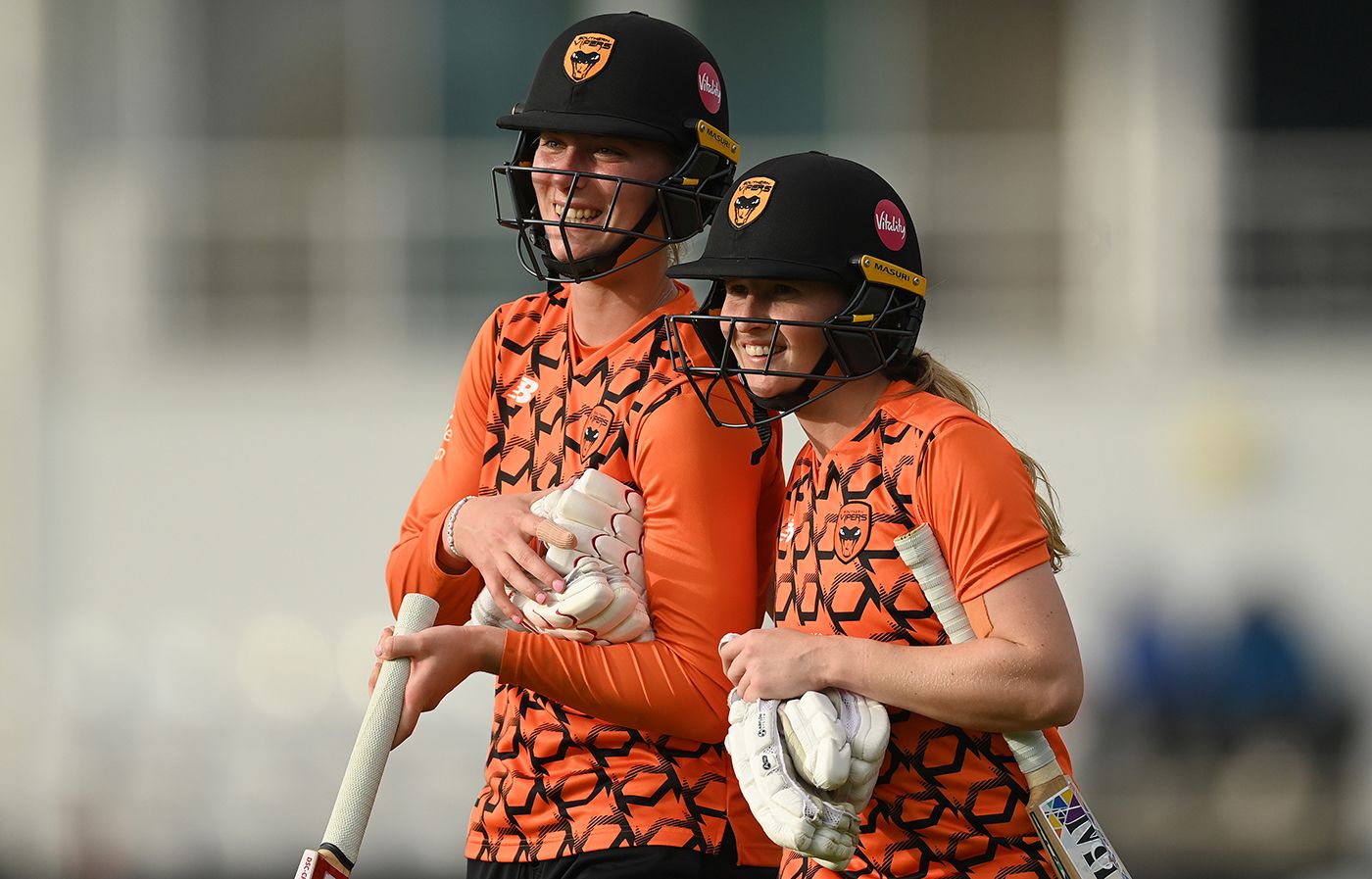 Freya Kemp and Emily Windsor leave the field after Southern Vipers won the Rachael Heyhoe Flint Trophy Final