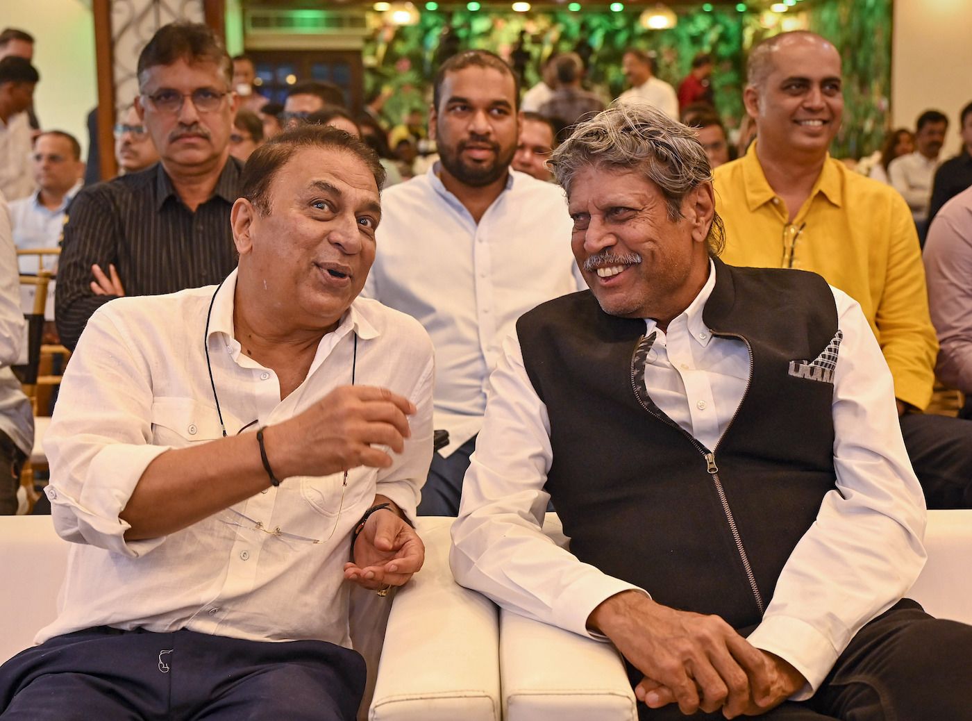 Former team-mates Sunil Gavaskar and Kapil Dev share a laugh at a book launch