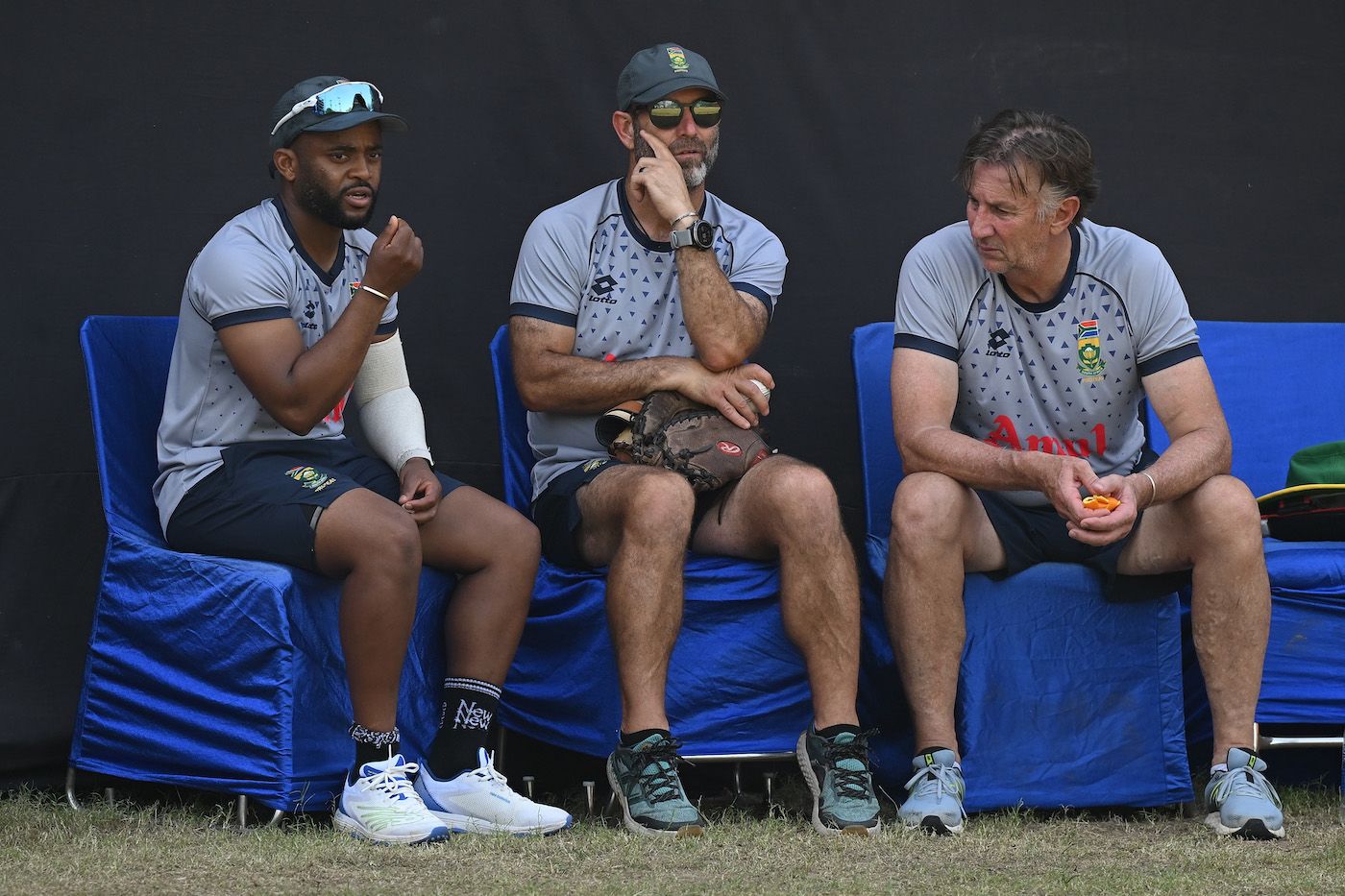 Temba Bavuma works out the team's plans with the coaching staff