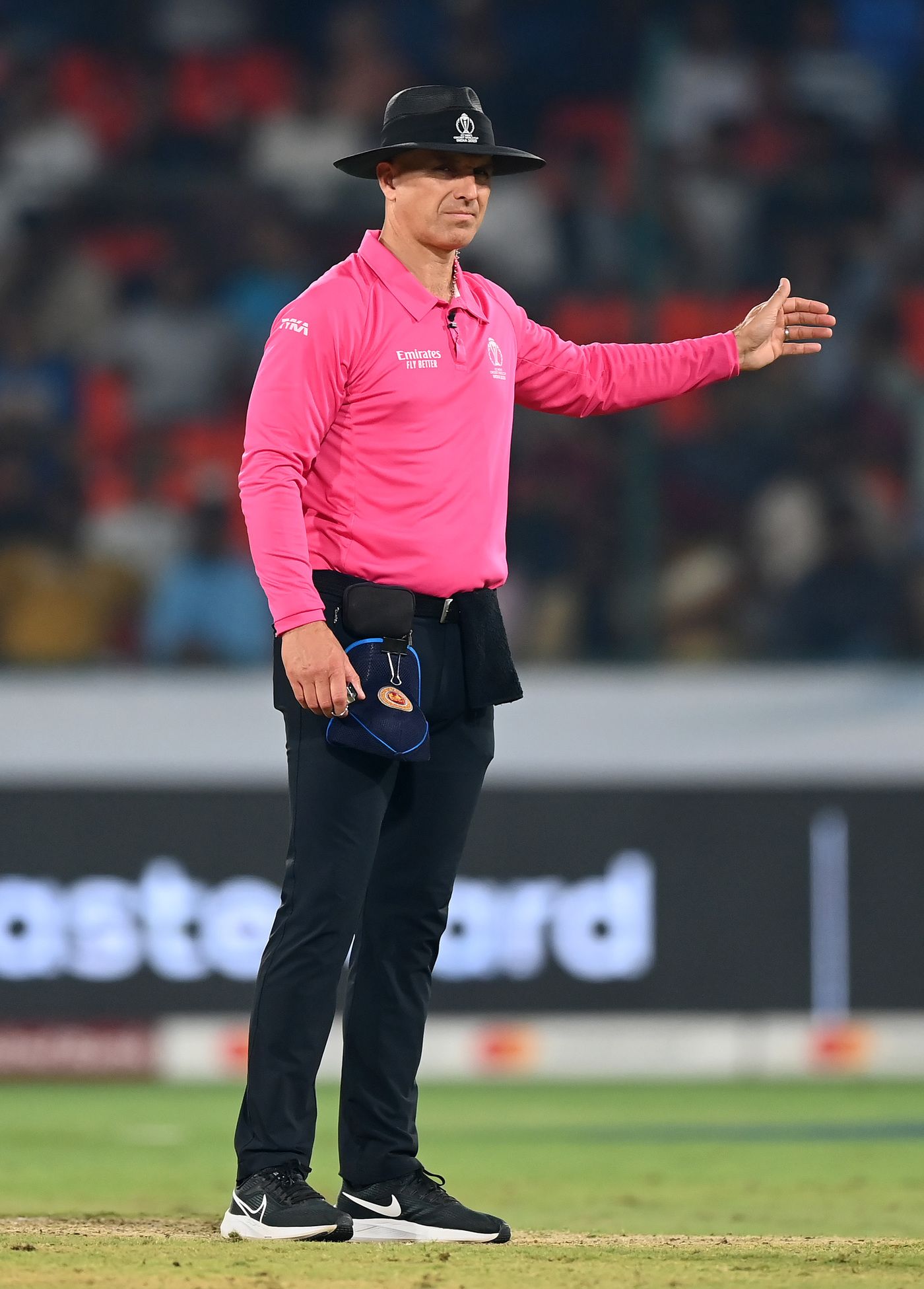 Umpire Alex Wharf signals a no ball