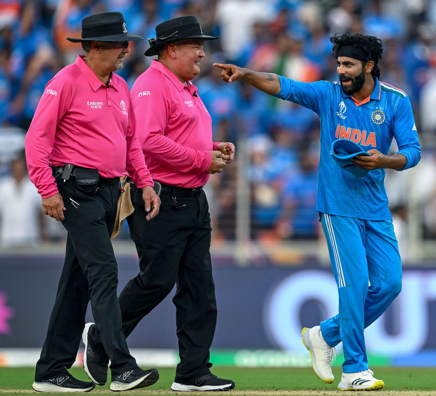 Ravindra Jadeja chats to Marais Erasmus and Richard Illingworth after overturning a decision