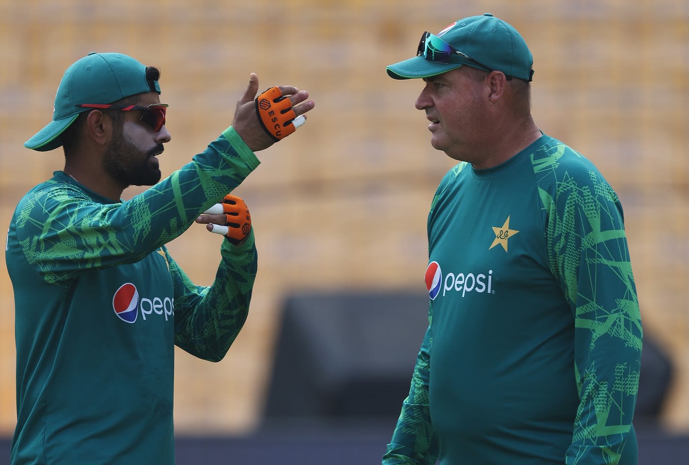 Babar Azam interacts with team director Mickey Arthur ahead of their game against South Africa