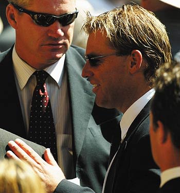 Shane Warne and Dean Jones arrive to pay their tributes