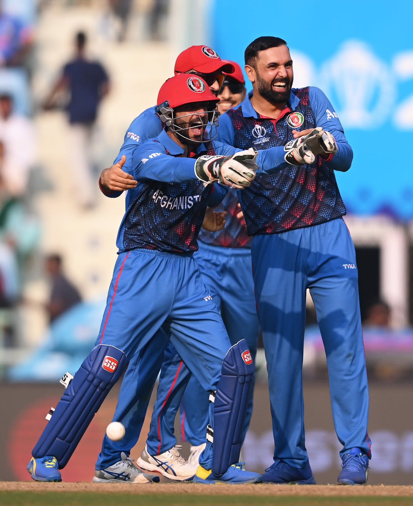 Ikram Alikhil gestures after effecting a smart glovework to run-out Colin Ackermann
