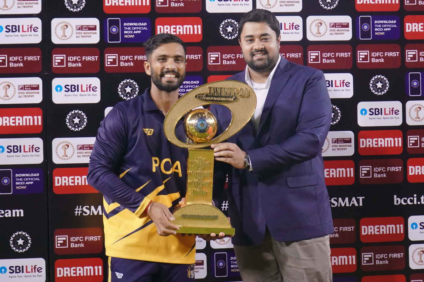 Mandeep Singh collects the trophy from PCA secretary Dilsher Khanna