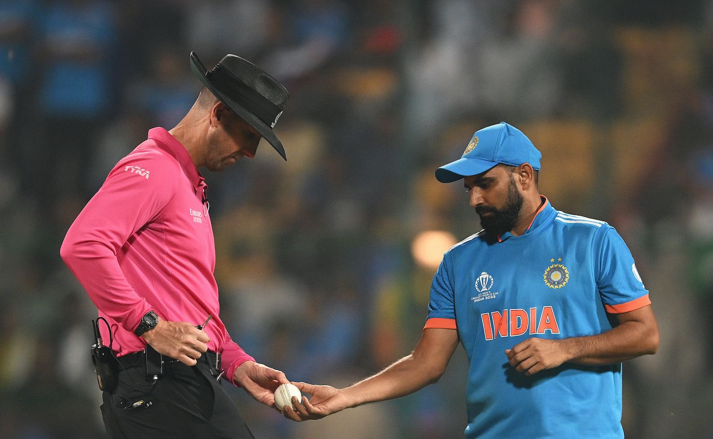Mohammed Shami gets a ball from Michael Gough