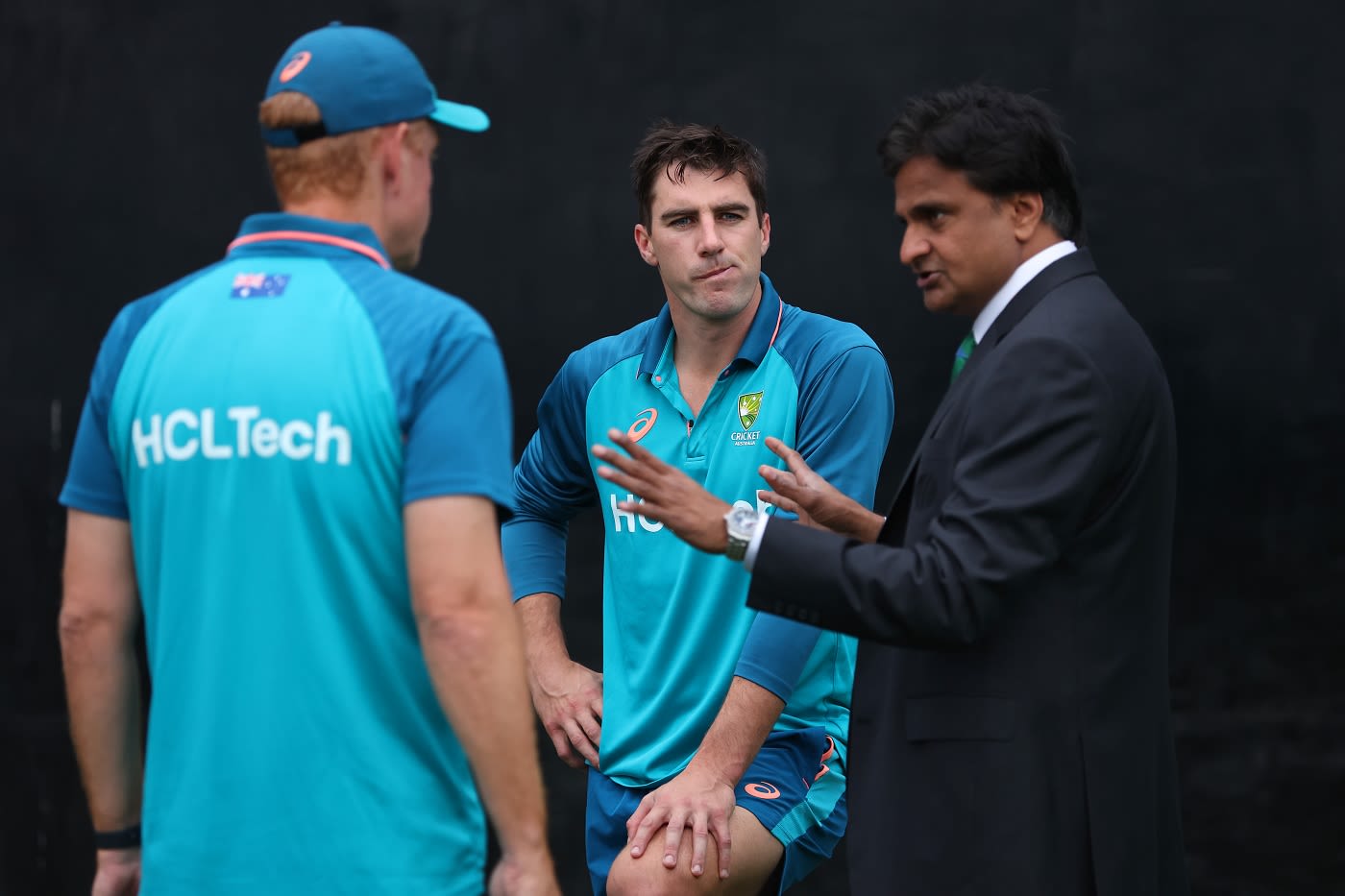 Pat Cummins and Andrew McDonald have a word with match referee Javagal Srinath