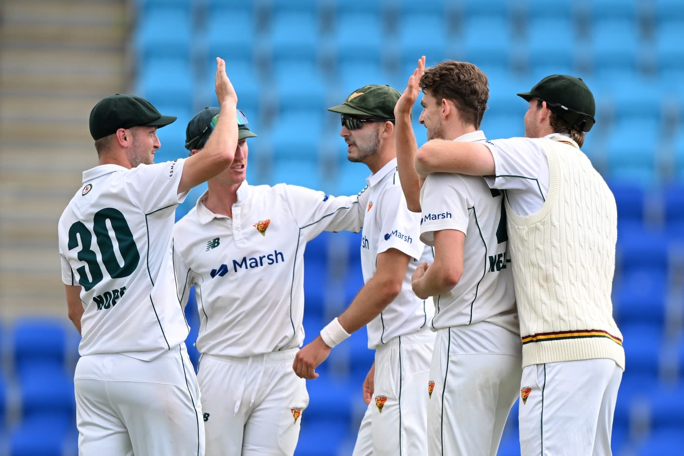 Lawrence Neil-Smith celebrates a wicket