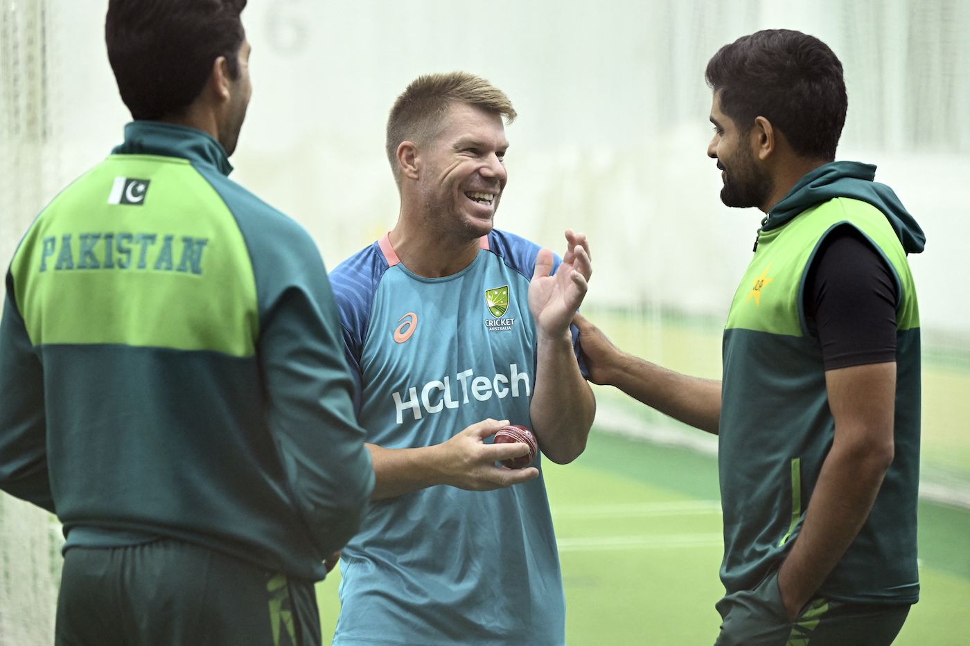 Umar Gul, David Warner and Babar Azam share a light moment in the nets
