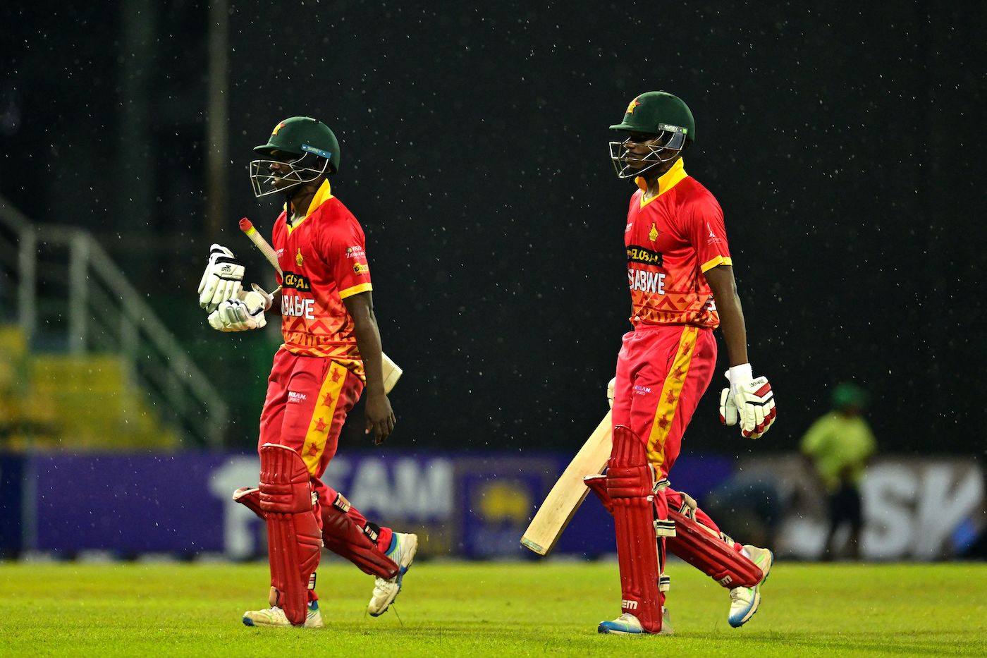 Takudzwanashe Kaitano and Milton Shumba walk back due to a rain interruption