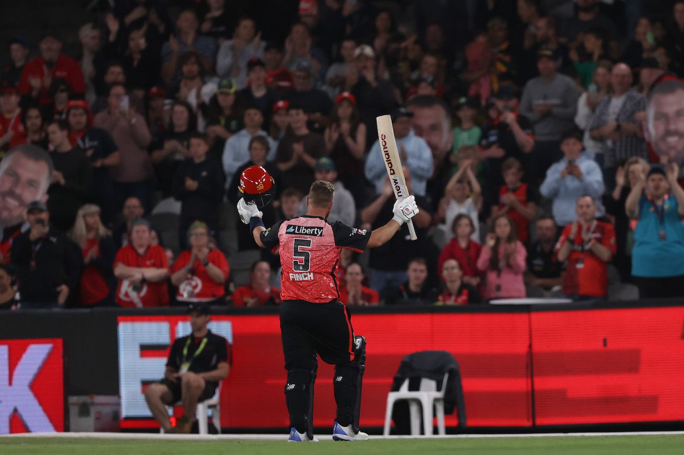 Aaron Finch acknowledges the ovation from the stands as he walks off