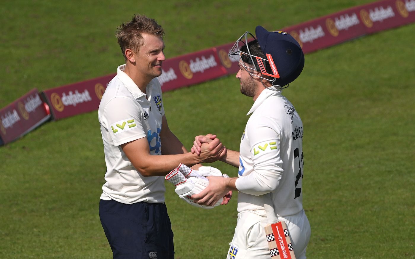 Ollie Robinson is congratulated by captain Scott Borthwick