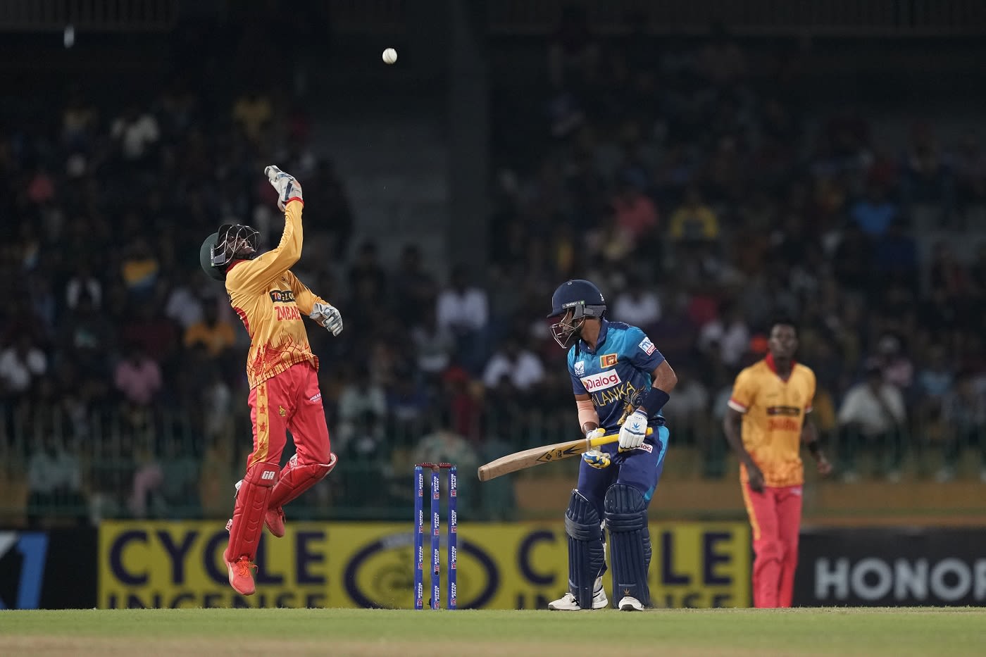 Clive Madande celebrates after taking Sadeera Samarawickrama's catch