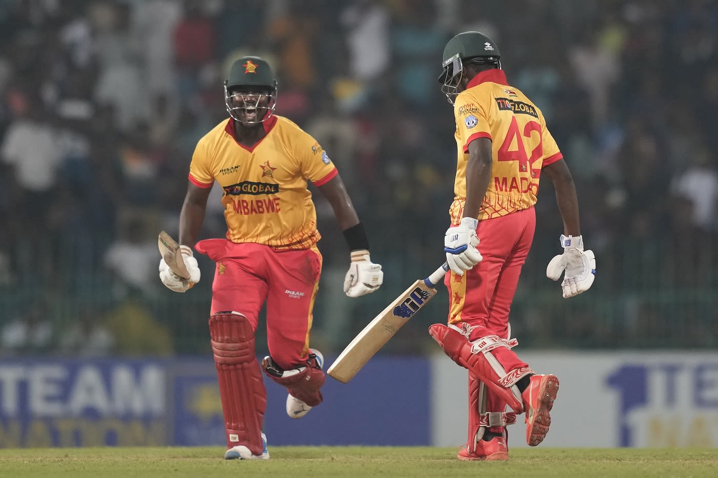 Luke Jongwe runs to celebrate a famous win with Clive Madande