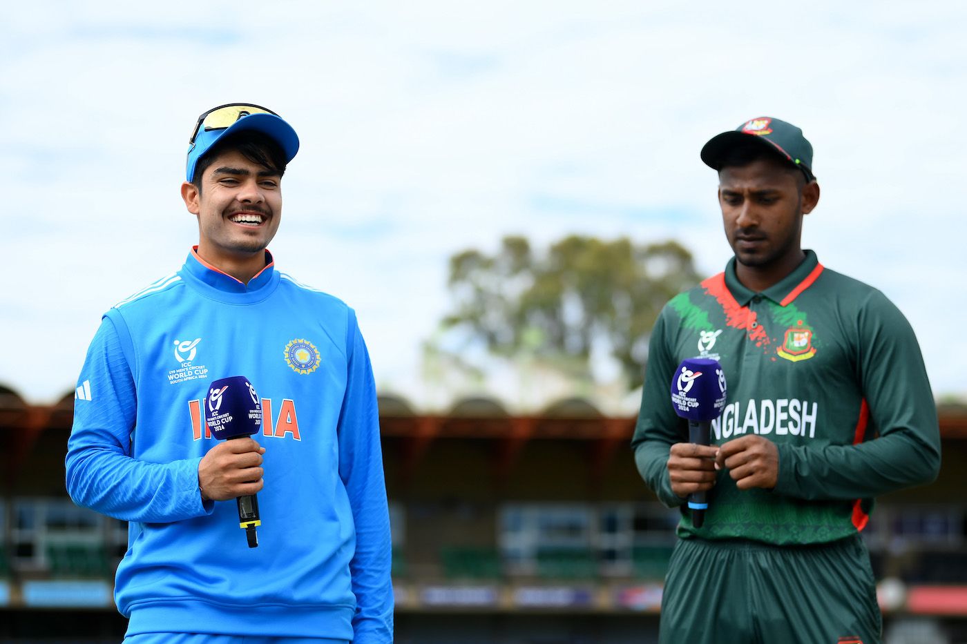Uday Saharan and Mahfuzur Rahman Rabby at the toss