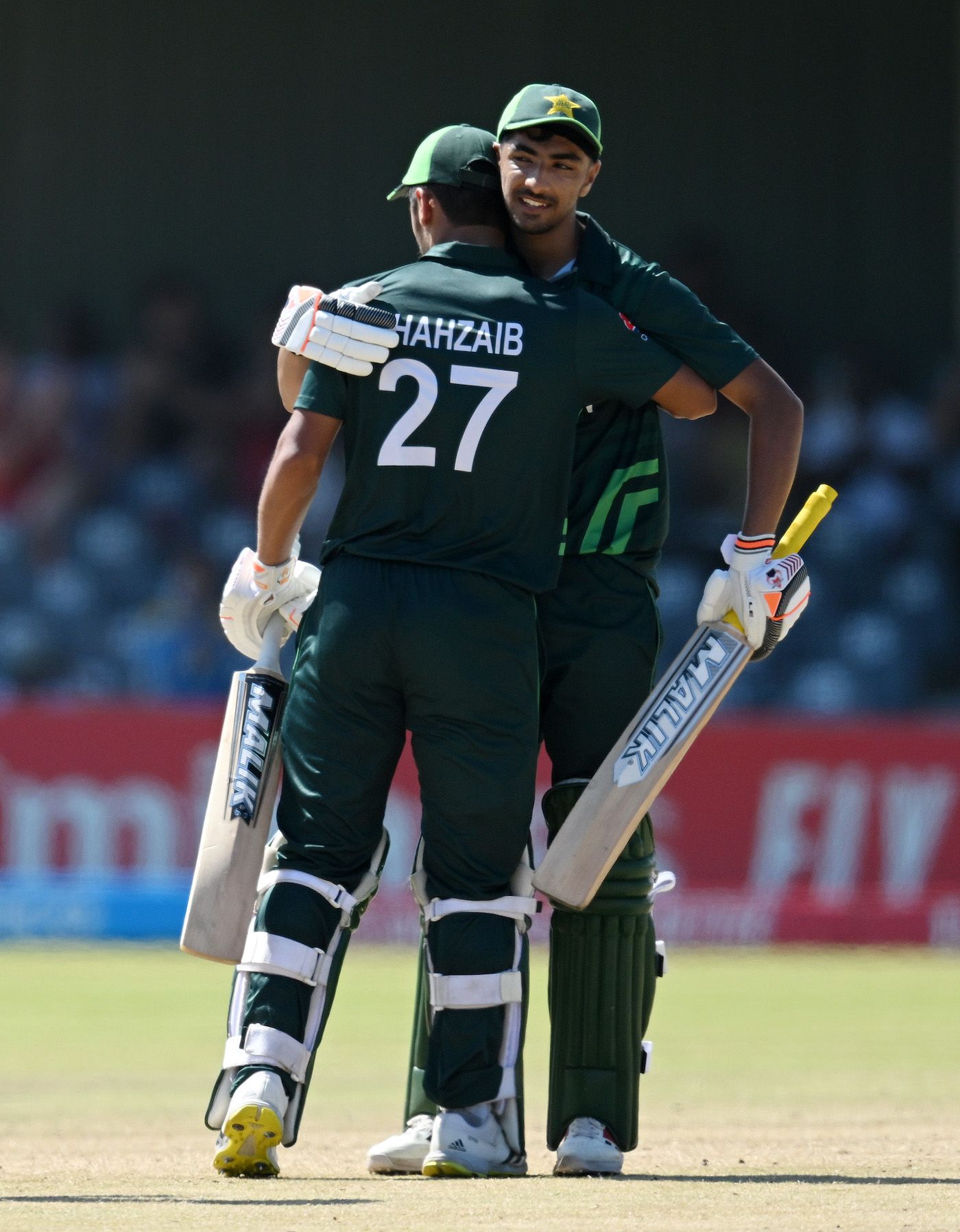 Pakistan openers Shamyl Hussain and Shahzaib Khan celebrate the win