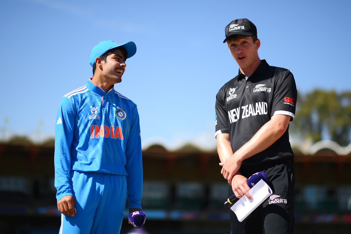 Uday Saharan and Oscar Jackson exchange notes at the toss