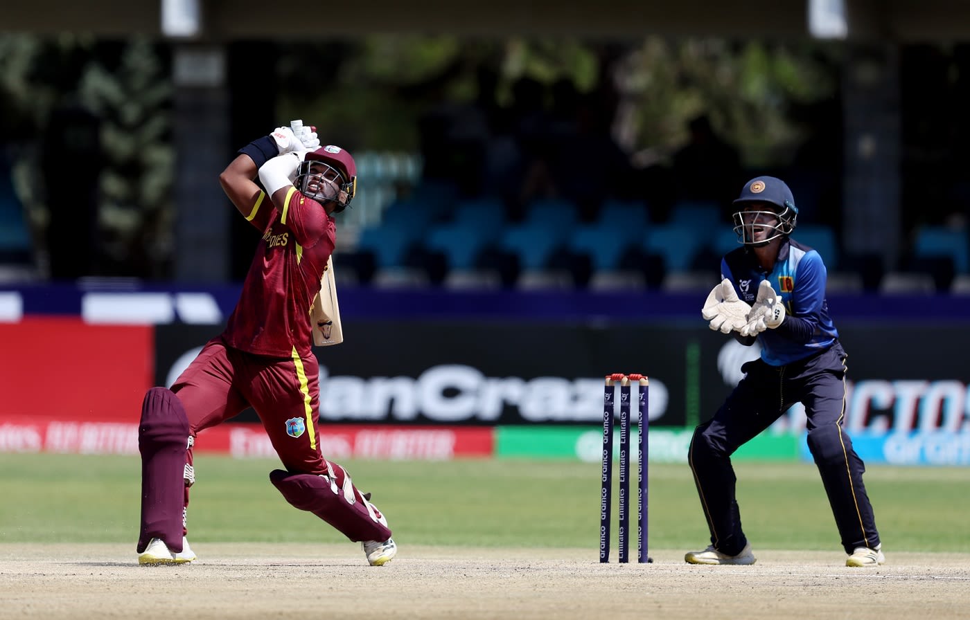 Steve Wedderburn goes aerial as wicketkeeper Sharujan Shanmuganathan looks on