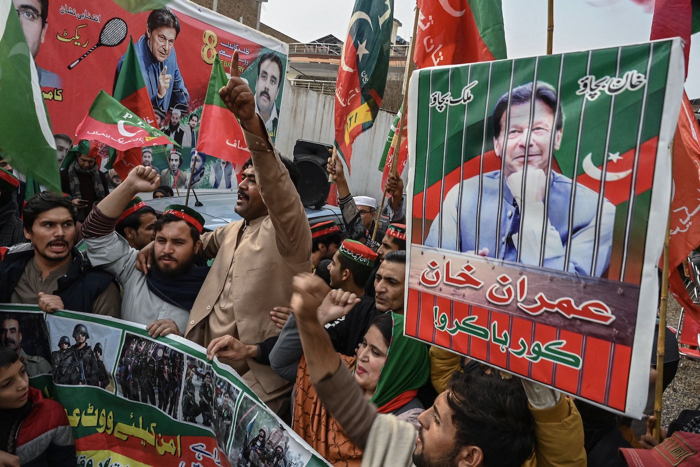 Supporters of Imran Khan's political party, Tehreek-e-Insaf, shout slogans during a protest in Peshawar