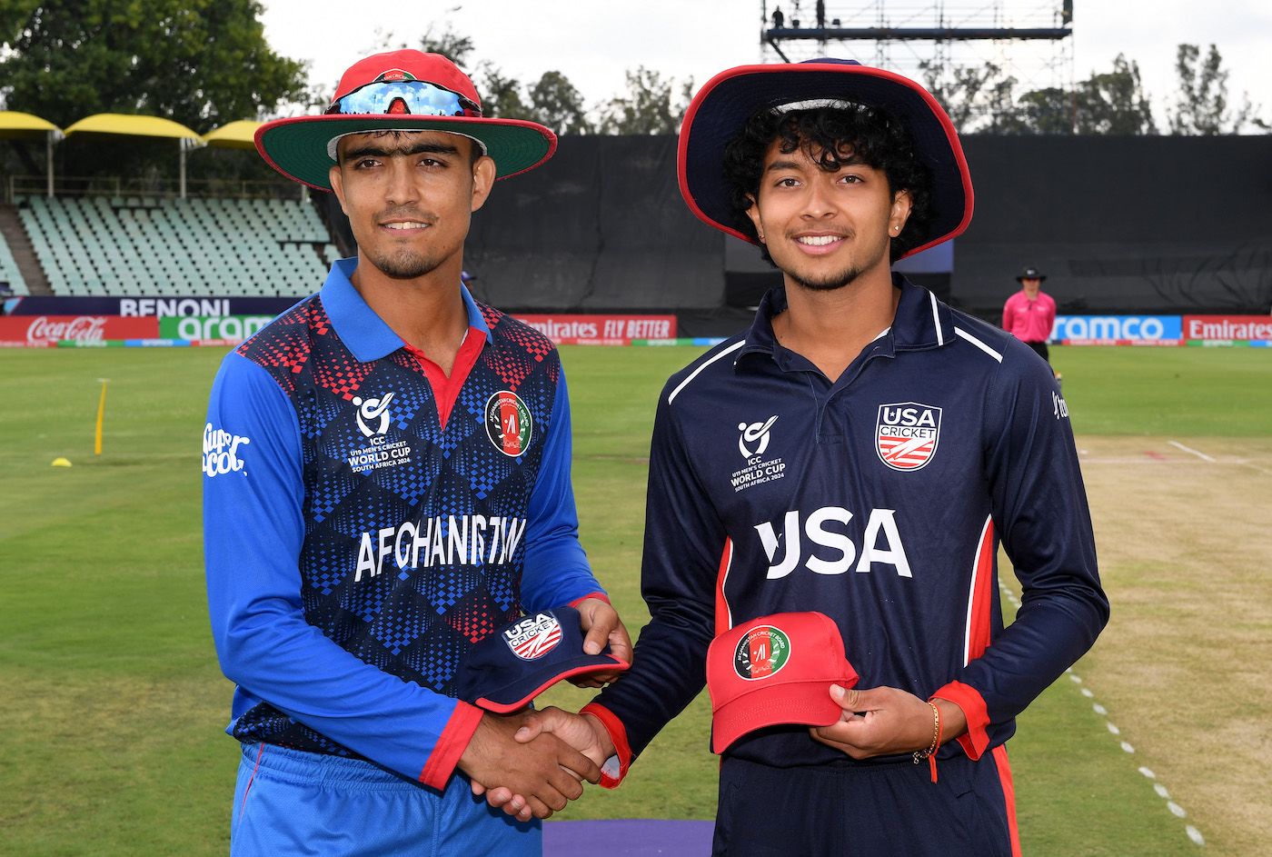 Naseer Khan Maroofkhil and Rishi Ramesh, the two captains, pose at the toss