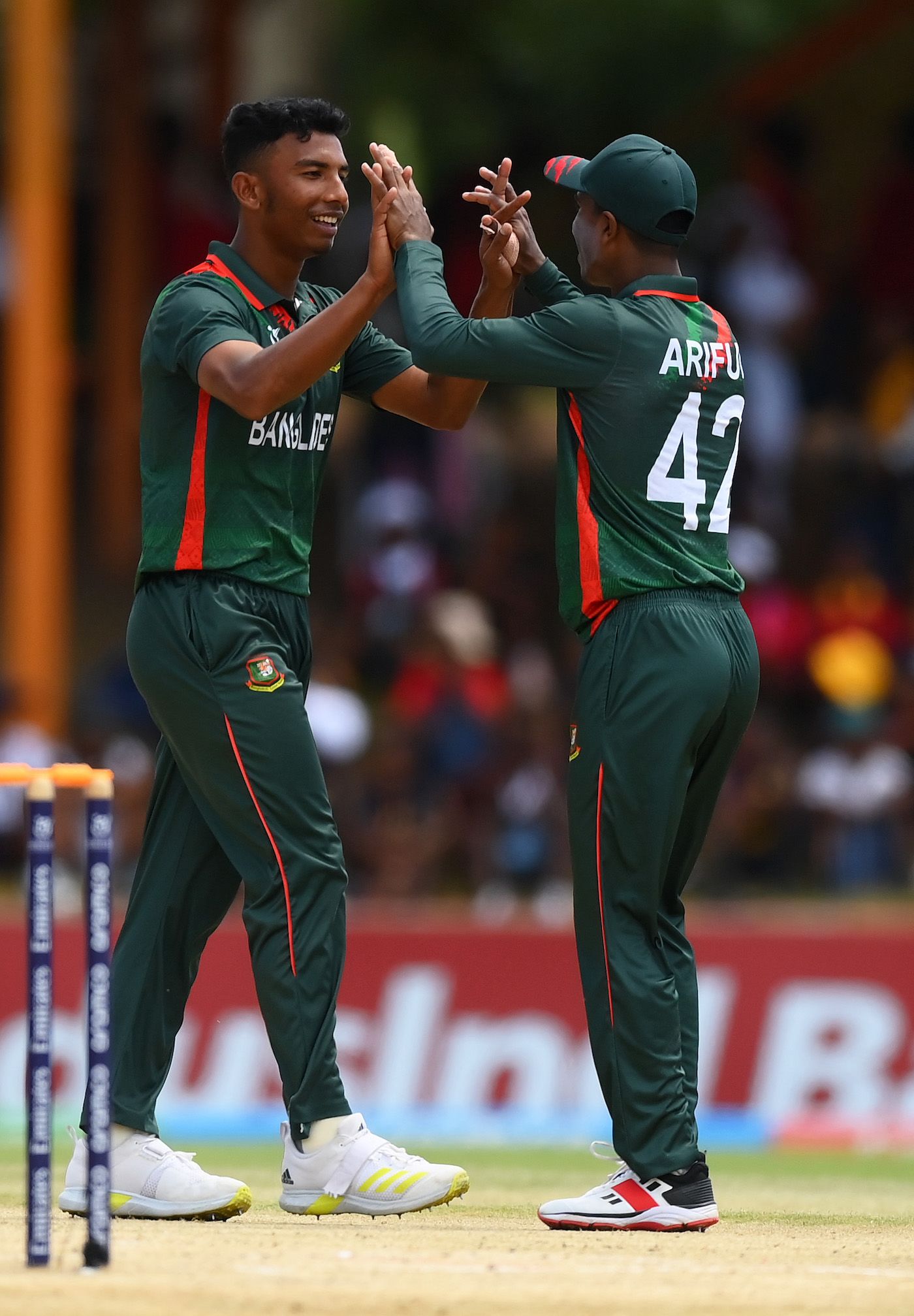 Iqbal Hossain Emon (L) and Ariful Islam celebrate
