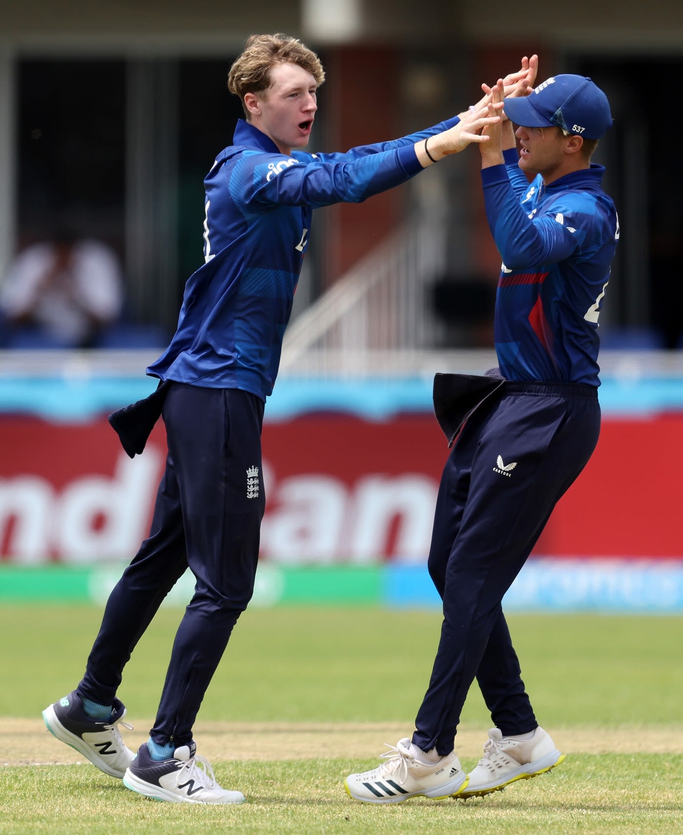 Theo Wiley and Luc Benkenstein celebrate after the former took two quick wickets