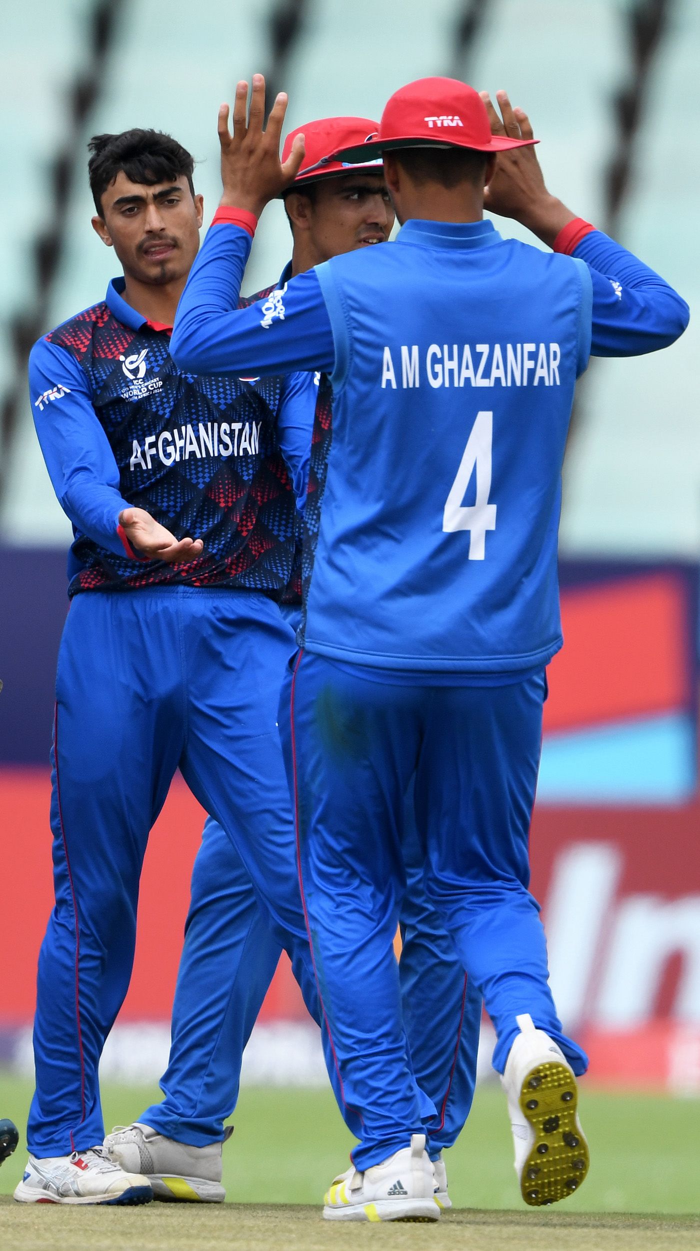 Arab Gul celebrates Aryaman Suri's wicket with his team-mates