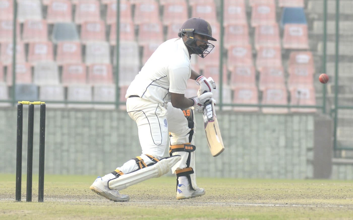 Ricky Bhui dinks the ball away